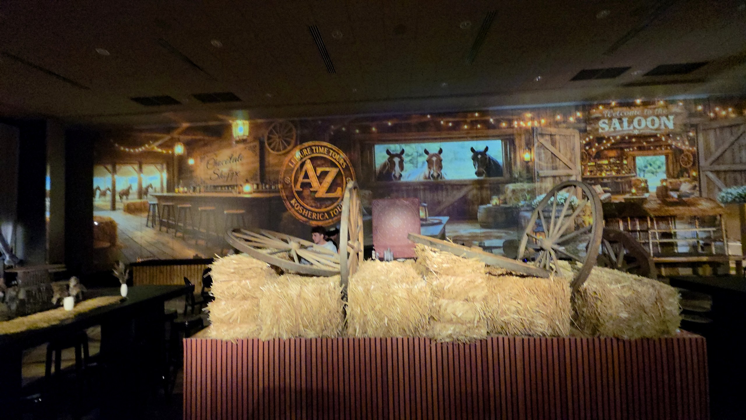 The bar built from hay bales under the projected barn
