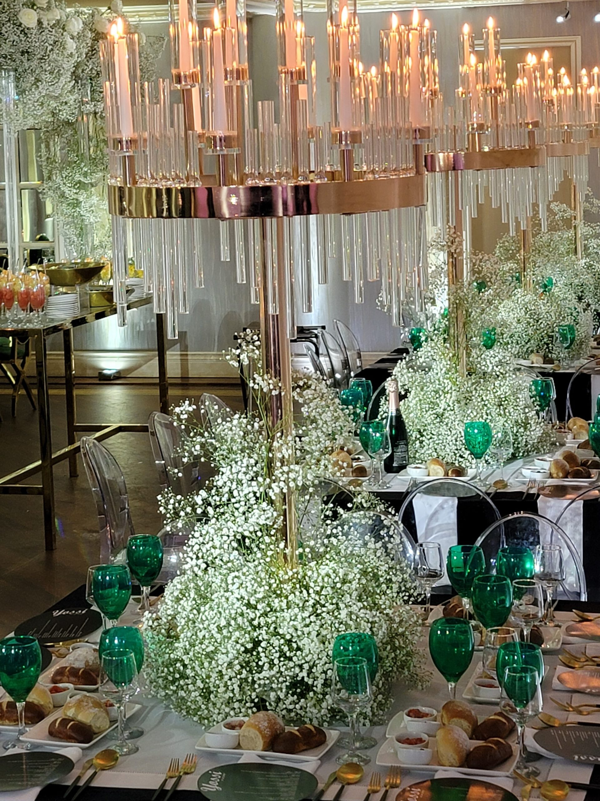 The long tables under the candle chandeliers, the mirrored wall behind