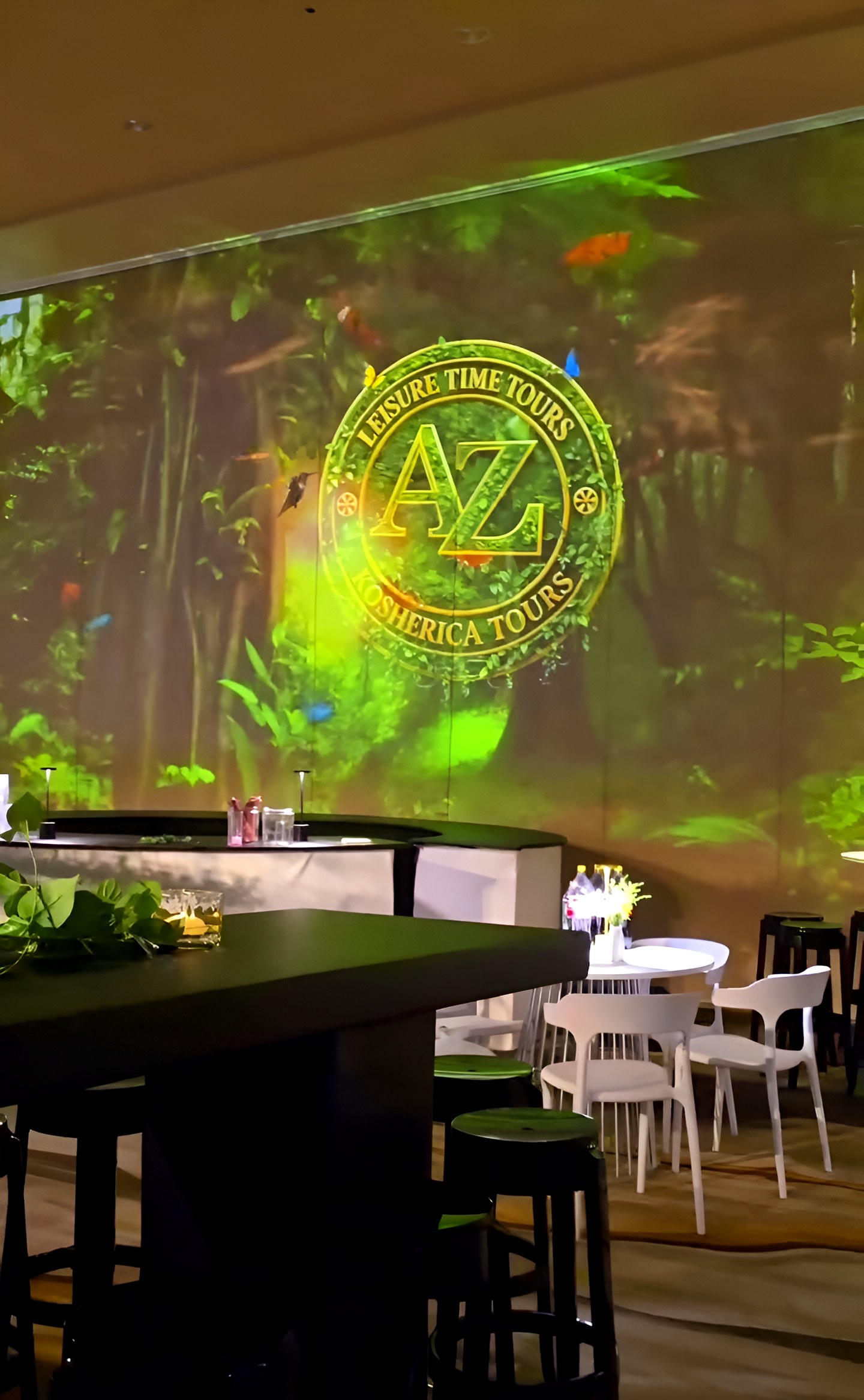 Tables in front of the projected forest wall