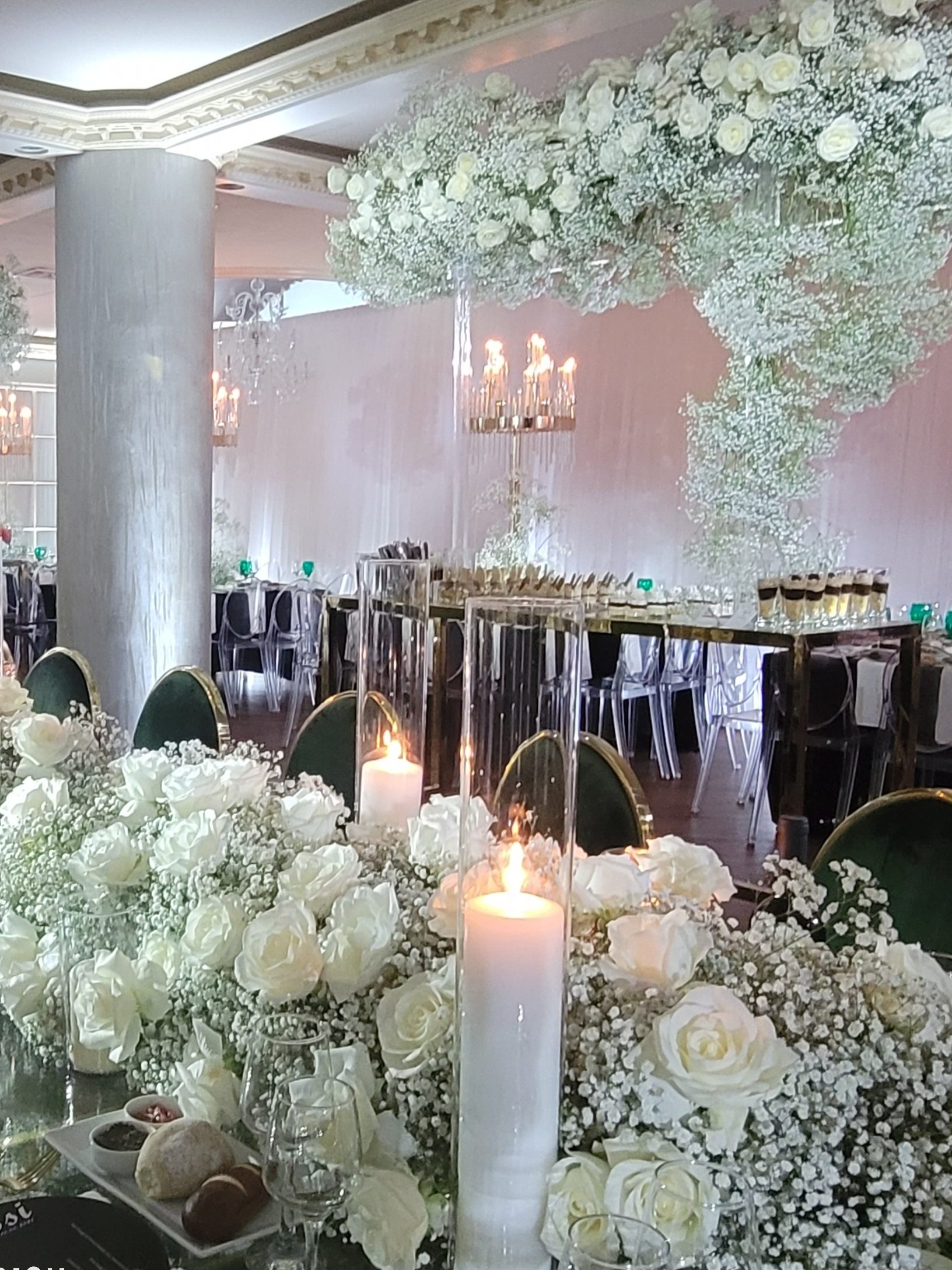 The hydrangea tables and the candles, the room lit white