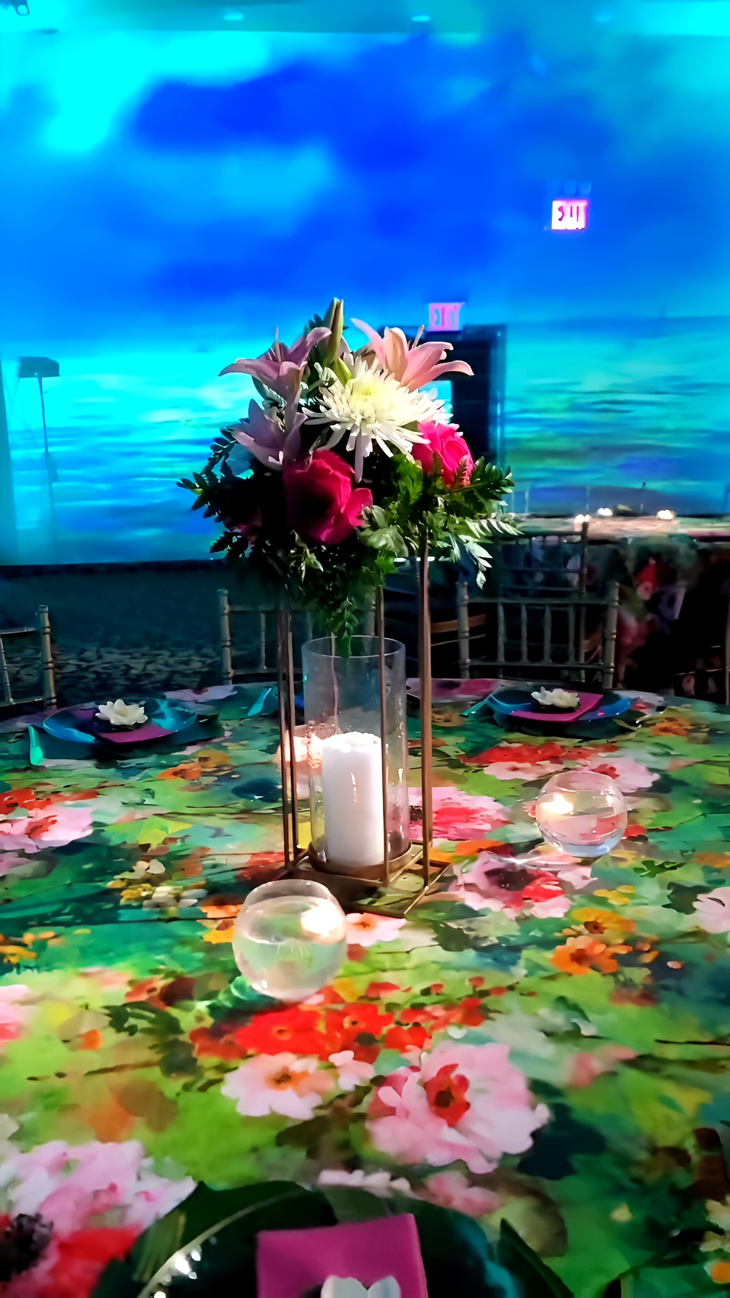 The Monet room: projected walls, lit tables, chandelier