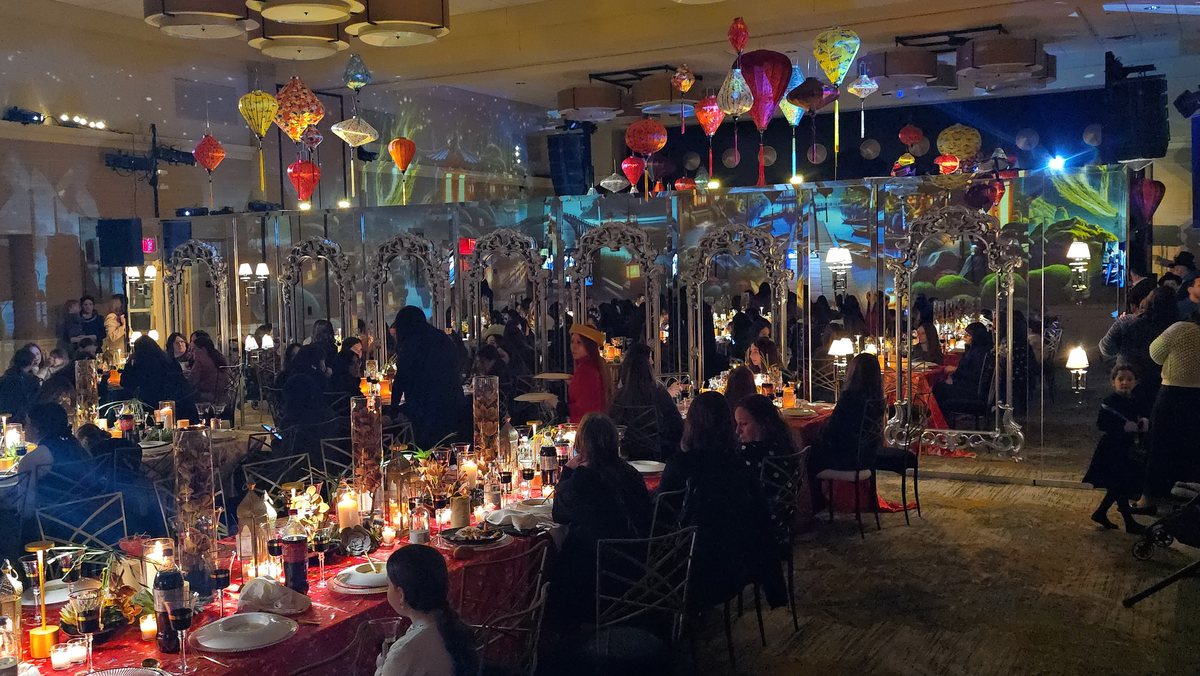 Coloured lanterns hung over the whole room above the dinner